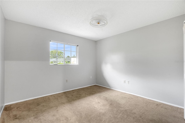 7700 Danube Dr Unit 7700, Hudson, FL 34667 - unfurnished room featuring carpet and a textured ceiling