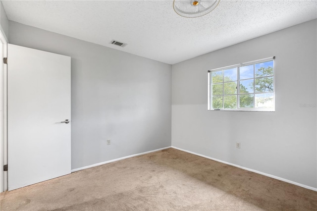 7700 Danube Dr Unit 7700, Hudson, FL 34667 - empty room featuring carpet and a textured ceiling