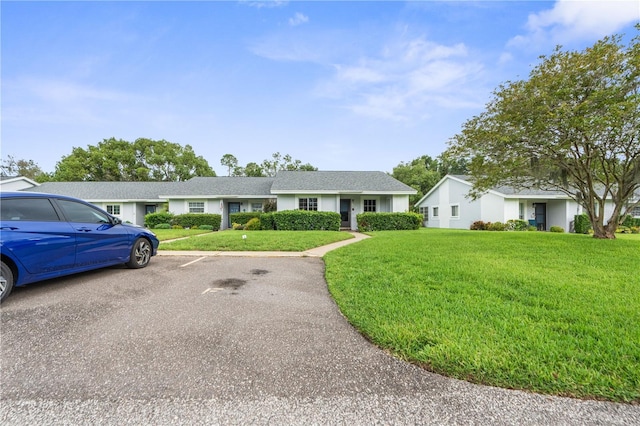 7700 Danube Dr Unit 7700, Hudson, FL 34667 - ranch-style home with a front yard and uncovered parking