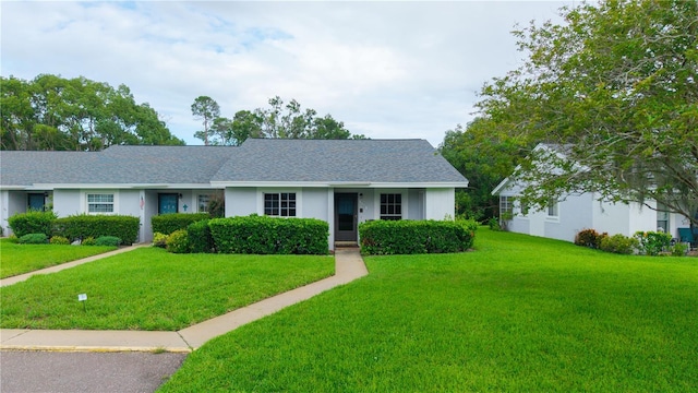 7700 Danube Dr Unit 7700, Hudson, FL 34667 - view of front facade featuring a front yard