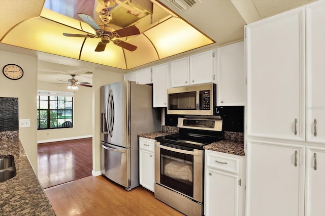 6654 Brambleleaf Dr, Spring Hill, FL 34606 - kitchen featuring stainless steel appliances, ceiling fan, white cabinetry, and light wood-style flooring