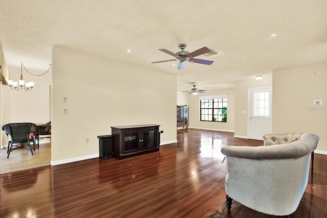 6654 Brambleleaf Dr, Spring Hill, FL 34606 - living area featuring a chandelier, a ceiling fan, dark wood-type flooring, a textured ceiling, and recessed lighting