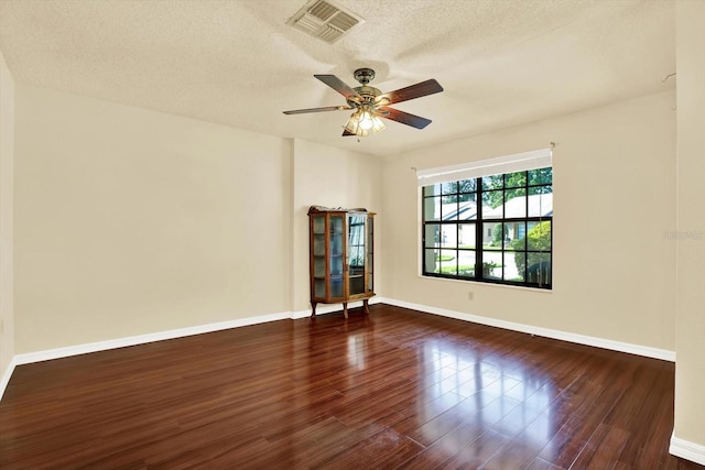 6654 Brambleleaf Dr, Spring Hill, FL 34606 - unfurnished room featuring wood finished floors, a ceiling fan, and a textured ceiling