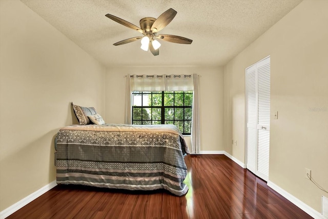 6654 Brambleleaf Dr, Spring Hill, FL 34606 - bedroom featuring wood finished floors, a textured ceiling, and a ceiling fan