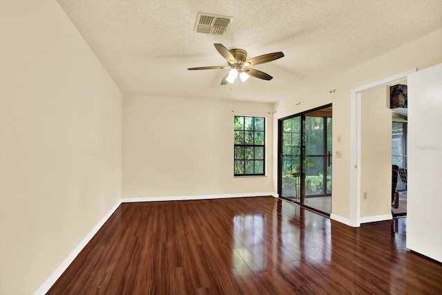 6654 Brambleleaf Dr, Spring Hill, FL 34606 - spare room with wood finished floors, ceiling fan, and a textured ceiling