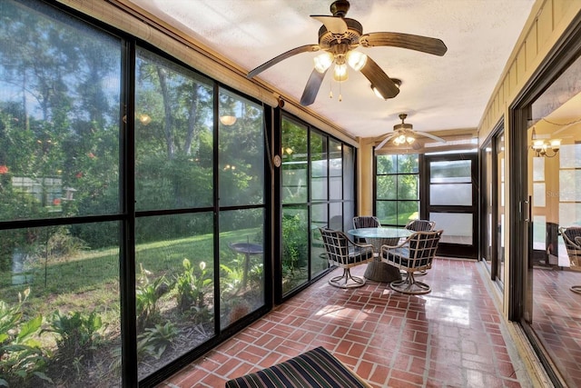 6654 Brambleleaf Dr, Spring Hill, FL 34606 - sunroom featuring brick flooring, ceiling fan, outdoor dining area, and a textured ceiling