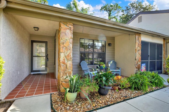 6654 Brambleleaf Dr, Spring Hill, FL 34606 - doorway to property featuring stone siding and stucco siding