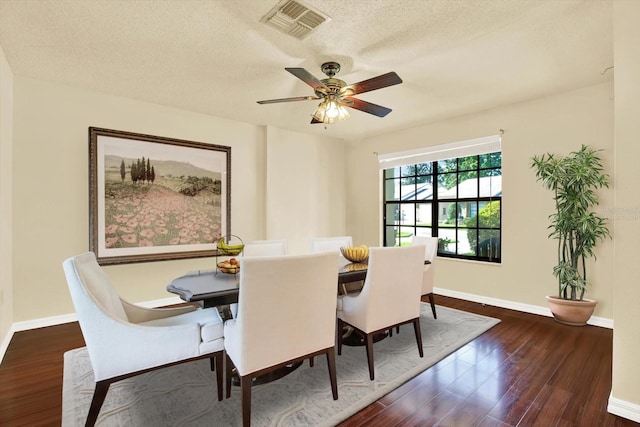 6654 Brambleleaf Dr, Spring Hill, FL 34606 - dining area featuring wood finished floors, a ceiling fan, and a textured ceiling