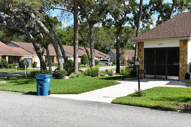 6575 Brambleleaf Dr, Spring Hill, FL 34606 - view of community featuring a yard and a residential view