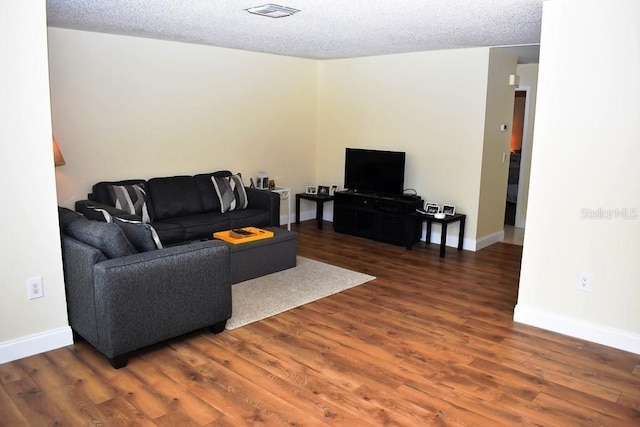 6575 Brambleleaf Dr, Spring Hill, FL 34606 - living room with wood finished floors and a textured ceiling