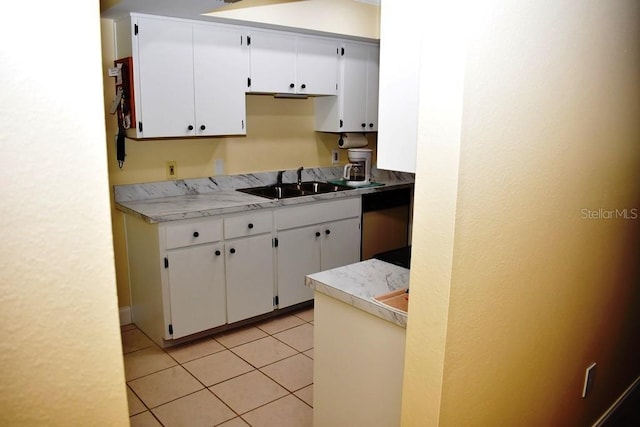 6575 Brambleleaf Dr, Spring Hill, FL 34606 - kitchen featuring white cabinetry, light tile patterned floors, and light countertops