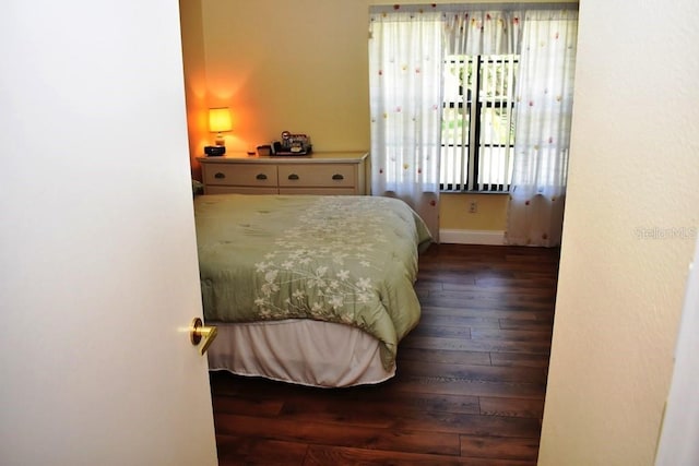 6575 Brambleleaf Dr, Spring Hill, FL 34606 - bedroom featuring hardwood / wood-style floors and baseboards