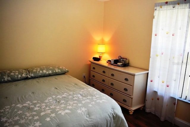 6575 Brambleleaf Dr, Spring Hill, FL 34606 - bedroom with dark wood-style flooring