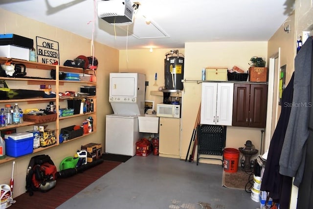 6575 Brambleleaf Dr, Spring Hill, FL 34606 - garage featuring stacked washer / dryer, water heater, and a garage door opener
