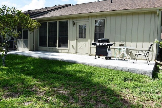 6575 Brambleleaf Dr, Spring Hill, FL 34606 - back of property featuring a patio and a shingled roof