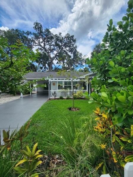 5710 Broadway Ave, New Port Richey, FL 34652 - view of front of home featuring concrete driveway and an attached carport