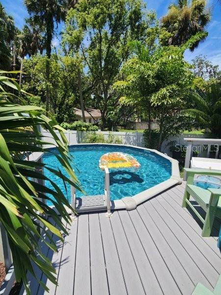 5710 Broadway Ave, New Port Richey, FL 34652 - view of swimming pool with a deck and a fenced backyard