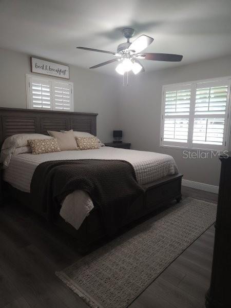 5710 Broadway Ave, New Port Richey, FL 34652 - bedroom featuring wood finished floors and ceiling fan