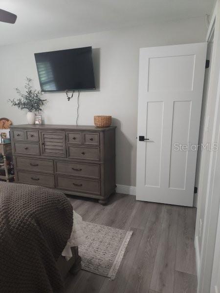 5710 Broadway Ave, New Port Richey, FL 34652 - bedroom featuring light wood finished floors and baseboards