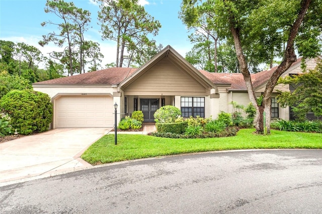 6085 Pekin Ct, Spring Hill, FL 34606 - ranch-style house featuring an attached garage, driveway, a front yard, and stucco siding