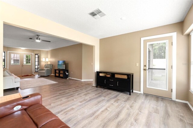 6085 Pekin Ct, Spring Hill, FL 34606 - living area featuring wood finished floors and ceiling fan
