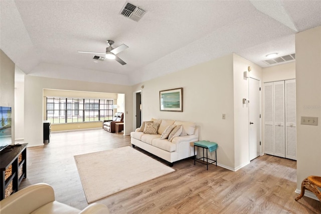 6085 Pekin Ct, Spring Hill, FL 34606 - living room featuring a textured ceiling, a ceiling fan, and wood finished floors