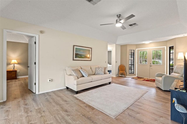 6085 Pekin Ct, Spring Hill, FL 34606 - living area with light wood-style floors and a ceiling fan
