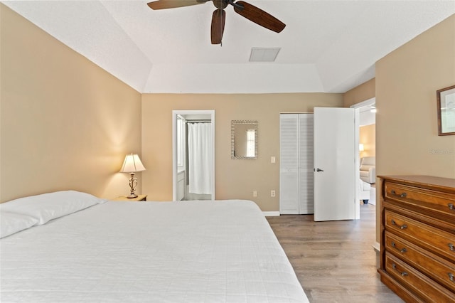 6085 Pekin Ct, Spring Hill, FL 34606 - bedroom featuring wood finished floors, a raised ceiling, and a ceiling fan