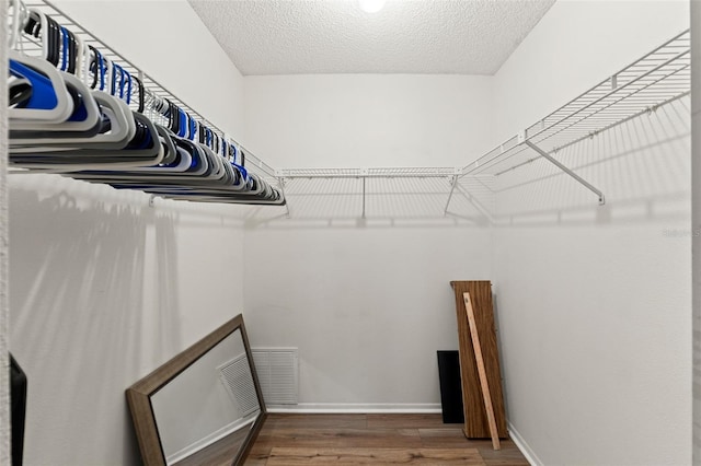 6085 Pekin Ct, Spring Hill, FL 34606 - spacious closet featuring wood finished floors
