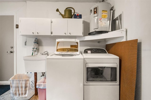 6085 Pekin Ct, Spring Hill, FL 34606 - washroom with washer and clothes dryer, electric water heater, and cabinet space