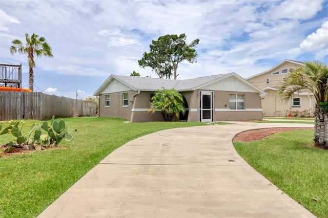 13637 Lagoon Dr, Hudson, FL 34667 - ranch-style house featuring stucco siding and curved driveway