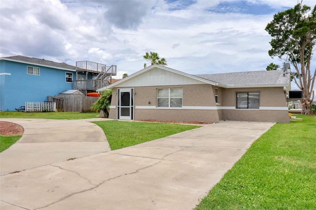 13637 Lagoon Dr, Hudson, FL 34667 - ranch-style house featuring driveway and stucco siding