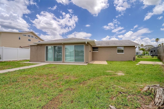 13637 Lagoon Dr, Hudson, FL 34667 - back of property featuring stucco siding and a patio