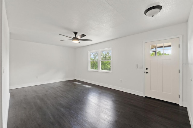 1324 Newhope Rd, Spring Hill, FL 34606 - entrance foyer with dark wood-type flooring, ceiling fan, and a textured ceiling