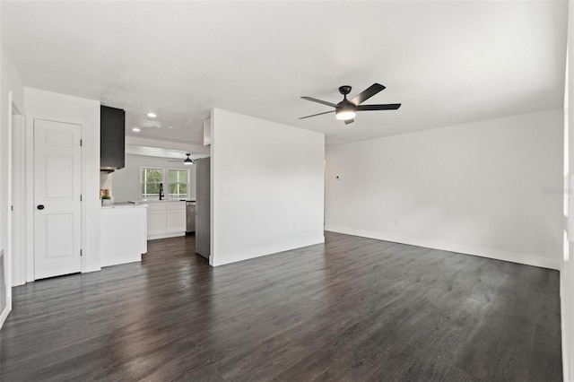1324 Newhope Rd, Spring Hill, FL 34606 - unfurnished living room featuring a ceiling fan, dark wood-style flooring, and recessed lighting