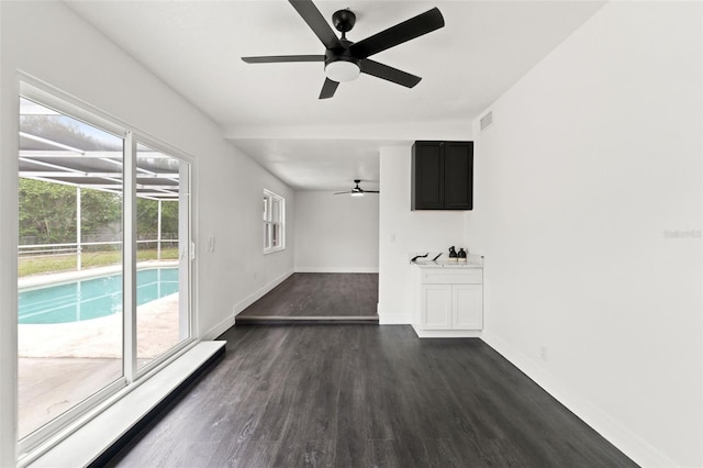 1324 Newhope Rd, Spring Hill, FL 34606 - unfurnished living room with ceiling fan and dark wood finished floors