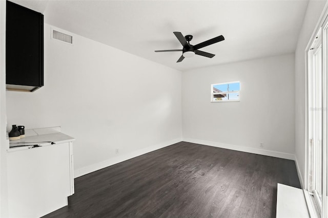 1324 Newhope Rd, Spring Hill, FL 34606 - unfurnished bedroom with dark wood-type flooring and a ceiling fan