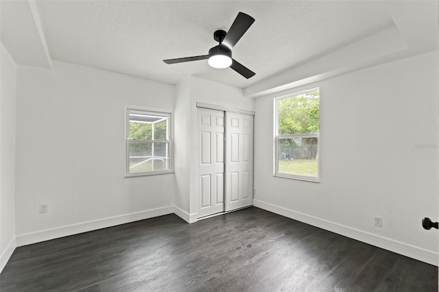 1324 Newhope Rd, Spring Hill, FL 34606 - unfurnished bedroom with dark wood-type flooring, a closet, and ceiling fan