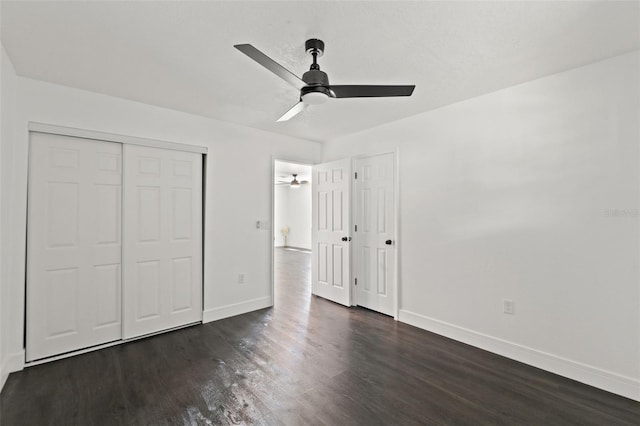 1324 Newhope Rd, Spring Hill, FL 34606 - unfurnished bedroom with dark wood finished floors, a closet, and a ceiling fan