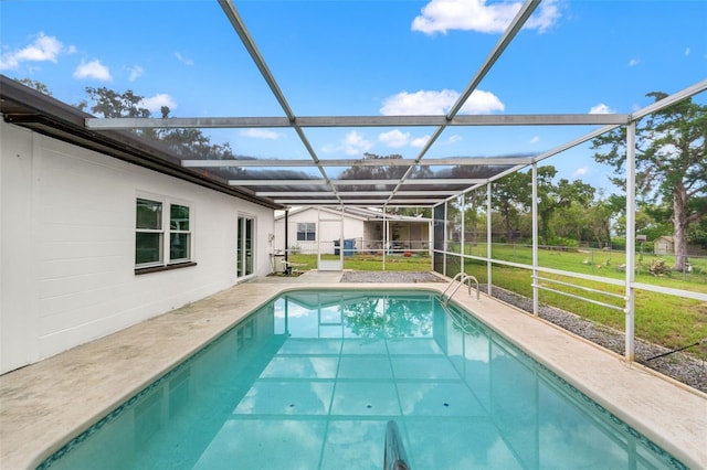 1324 Newhope Rd, Spring Hill, FL 34606 - swimming pool with a yard, glass enclosure, and a patio area