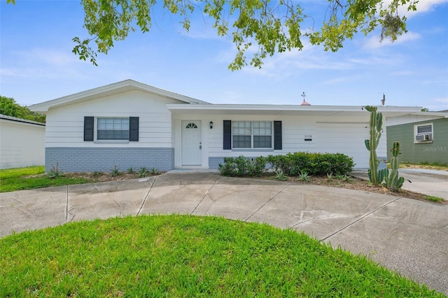 3528 Sheryl Hill Dr, Holiday, FL 34691 - ranch-style house with brick siding and curved driveway