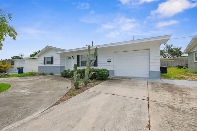 3528 Sheryl Hill Dr, Holiday, FL 34691 - single story home featuring concrete driveway, brick siding, and a garage