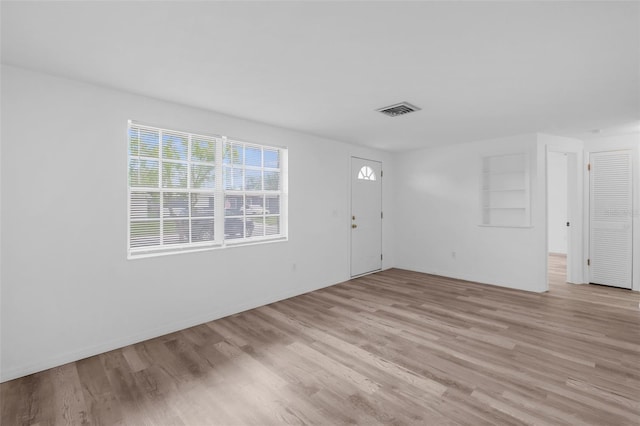 3528 Sheryl Hill Dr, Holiday, FL 34691 - entrance foyer featuring light wood-style flooring