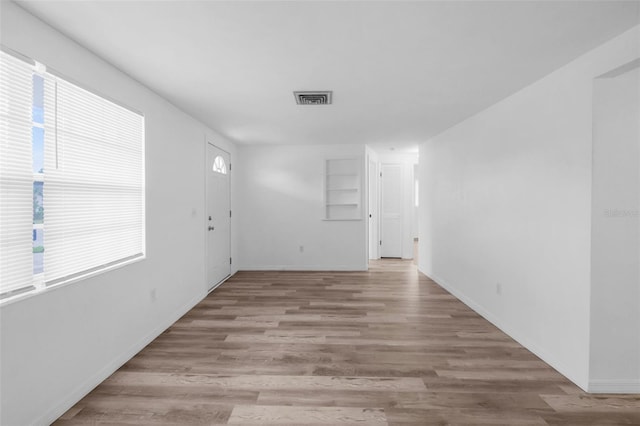 3528 Sheryl Hill Dr, Holiday, FL 34691 - unfurnished room featuring light wood-type flooring