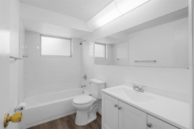3528 Sheryl Hill Dr, Holiday, FL 34691 - full bathroom featuring wood finished floors, vanity, and tub / shower combination