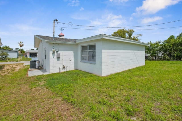 3528 Sheryl Hill Dr, Holiday, FL 34691 - rear view of property featuring a lawn