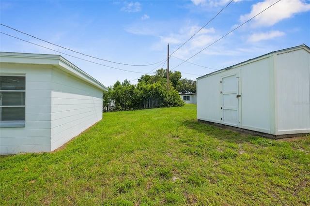 3528 Sheryl Hill Dr, Holiday, FL 34691 - view of grassy yard featuring a shed