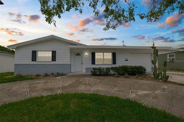 3528 Sheryl Hill Dr, Holiday, FL 34691 - ranch-style home featuring brick siding and driveway