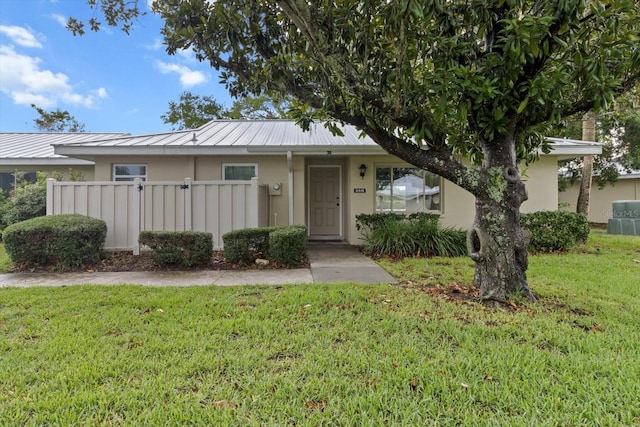 11446 W Bayshore Dr Unit 36, Crystal River, FL 34429 - view of front of home featuring stucco siding, a metal roof, and a standing seam roof
