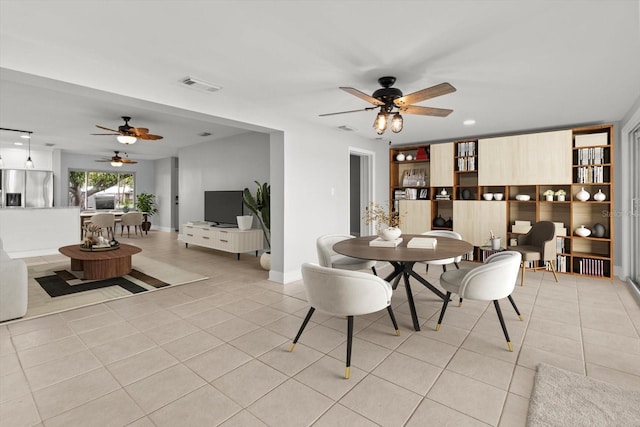 11446 W Bayshore Dr Unit 36, Crystal River, FL 34429 - dining room with ceiling fan and light tile patterned floors